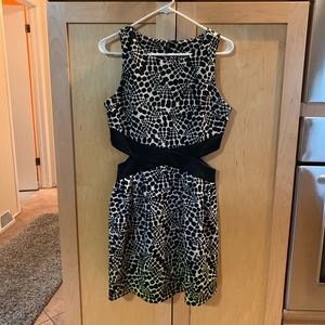 Very good used condition dress with cut outs